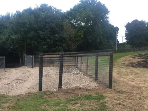 Creosote post and rail with horse netting